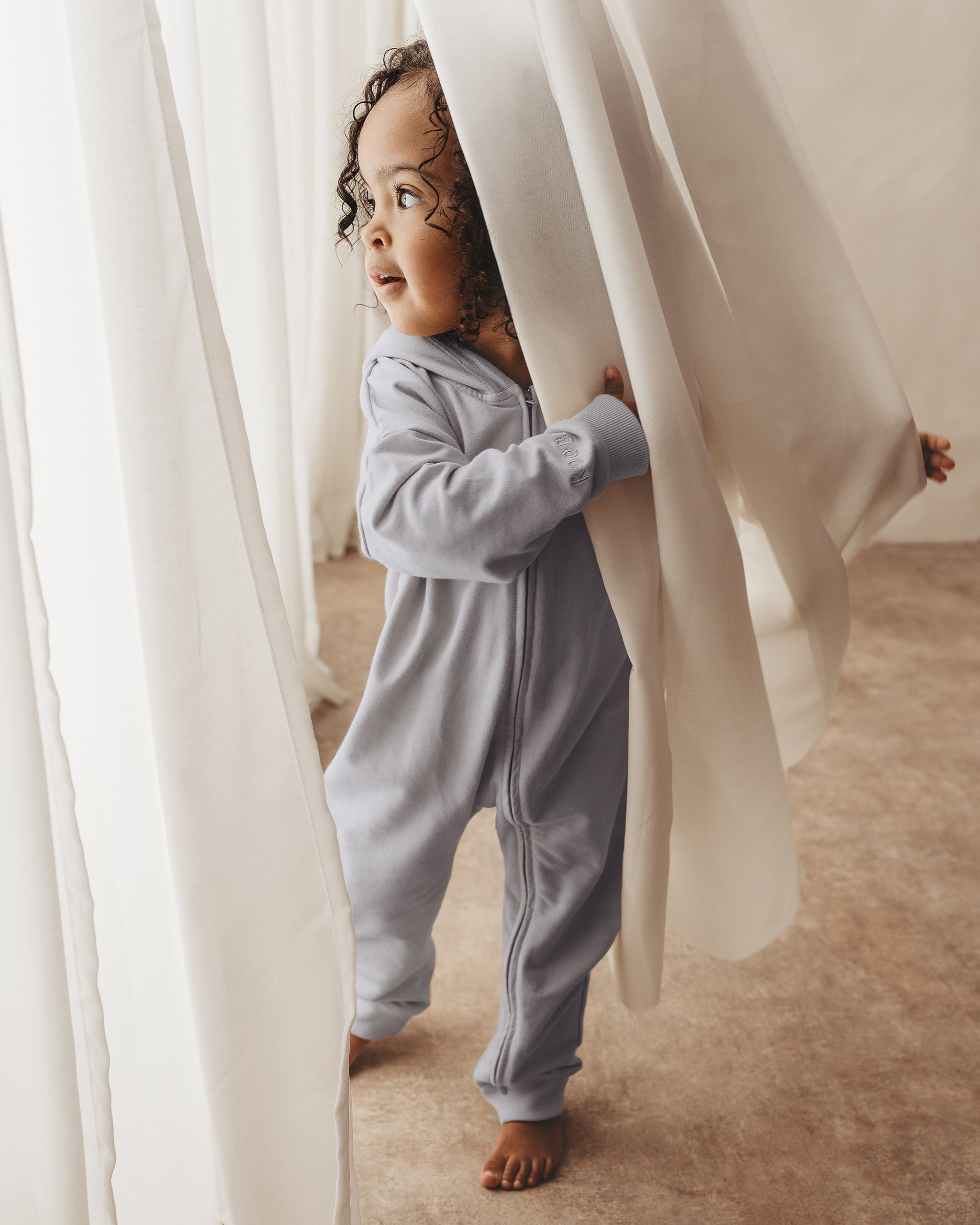 ROOBiE toddler jumpsuit in BONDi BREEZE – soft blue hooded one-piece, versatile mix-and-match essential