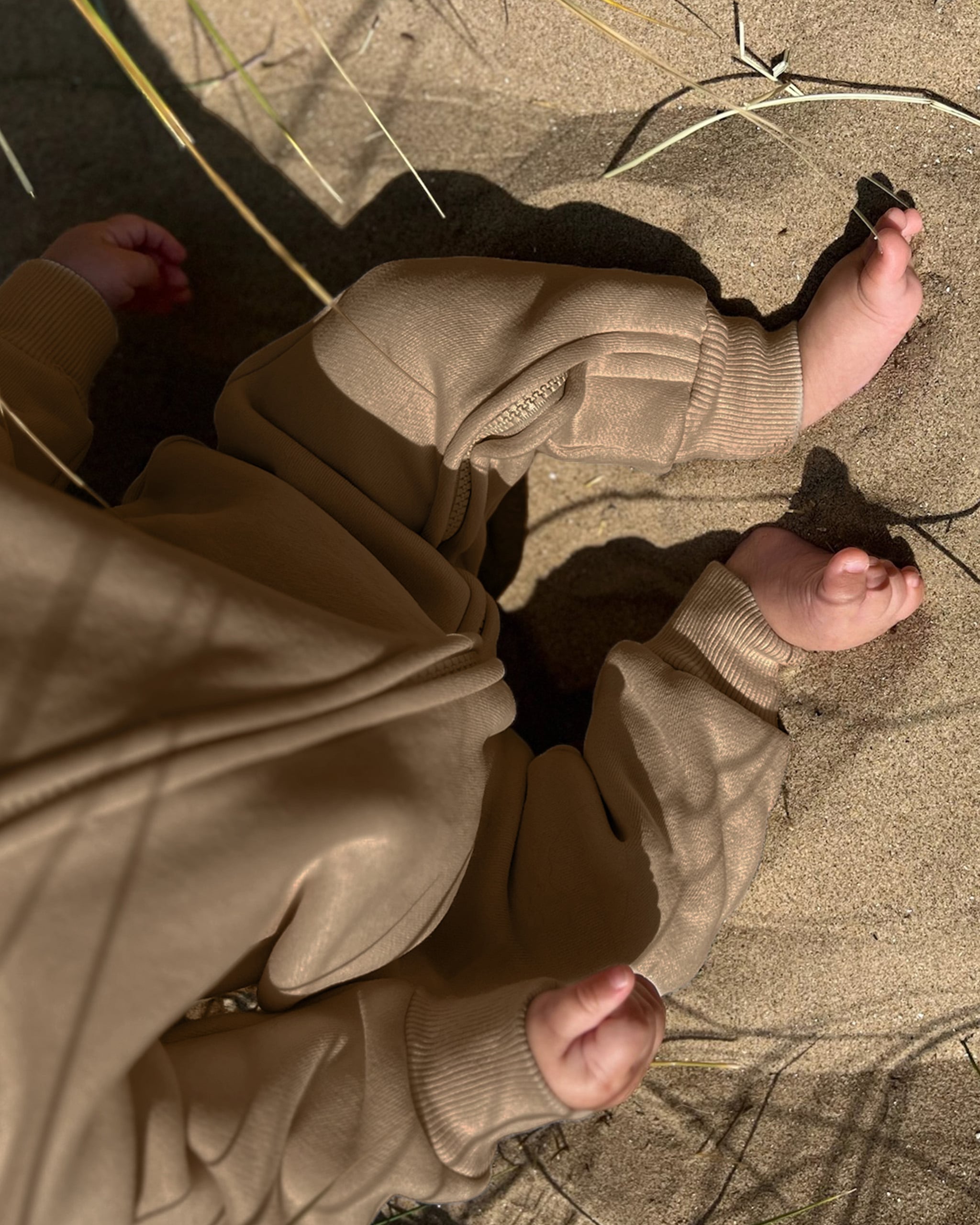 ROOBiE toddler jumpsuit in CHOCCY BiCCY – rich brown hooded one-piece, capsule wardrobe staple for toddlers