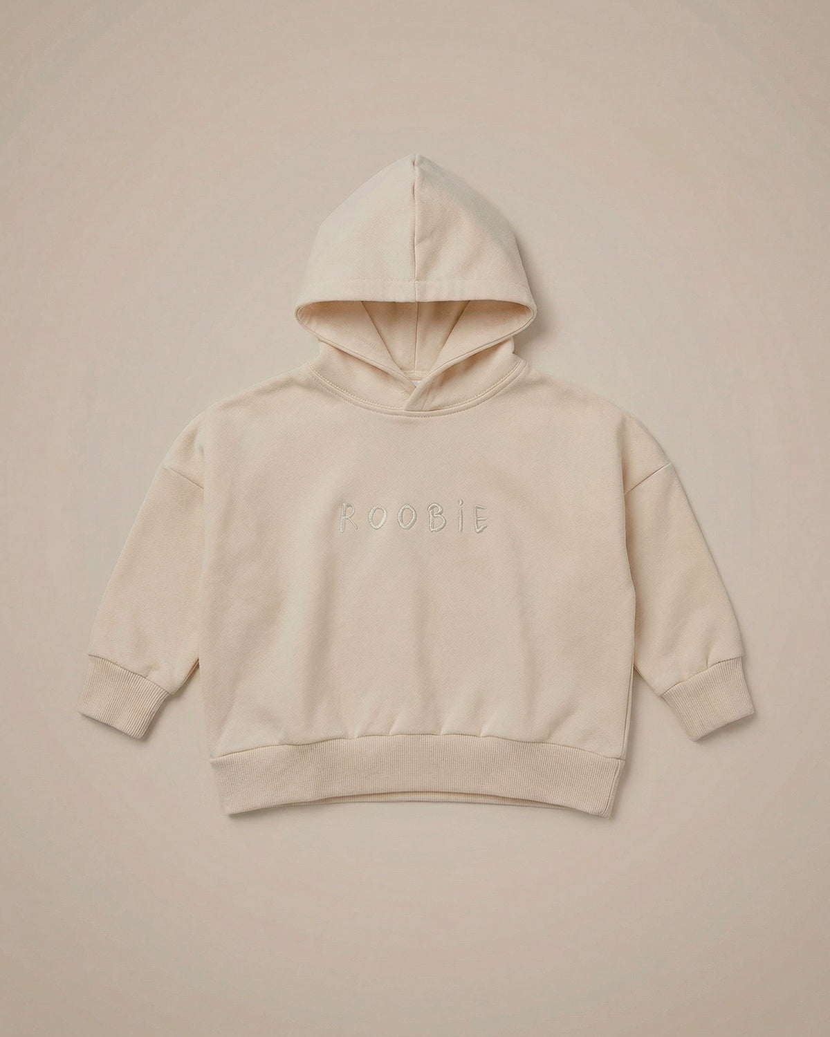 ROOBiE hoodie in cream, with oversized fit, hooded neckline and long sleeves.