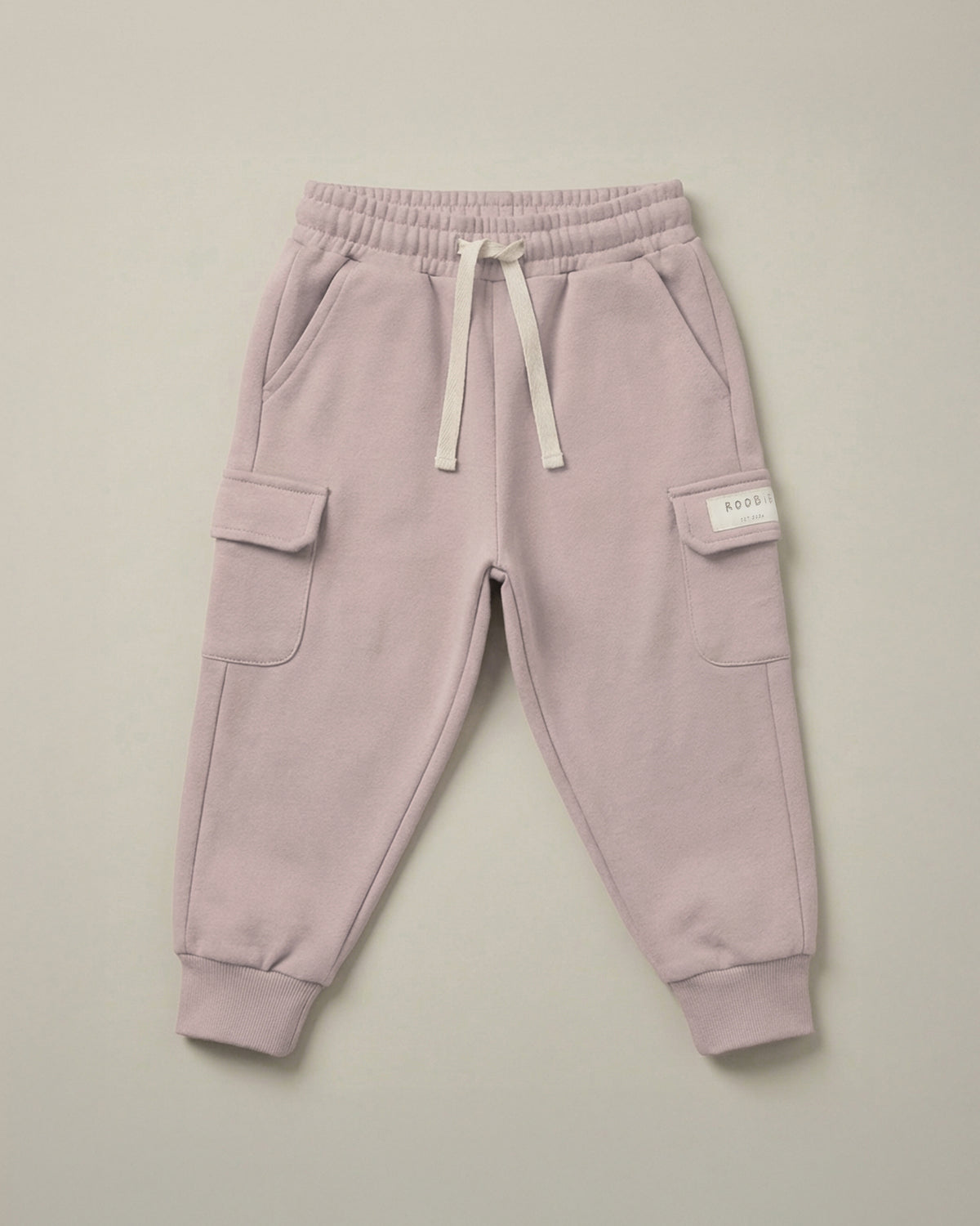 ROOBiE cargo trousers in soft pink, with cargo pockets, oversized fit and elasticated waist.